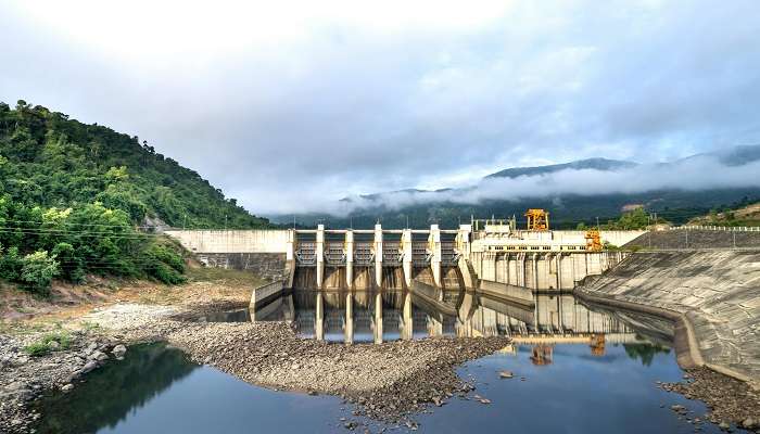 Tranquil reflection of trees on the water at Korokoro Dam 