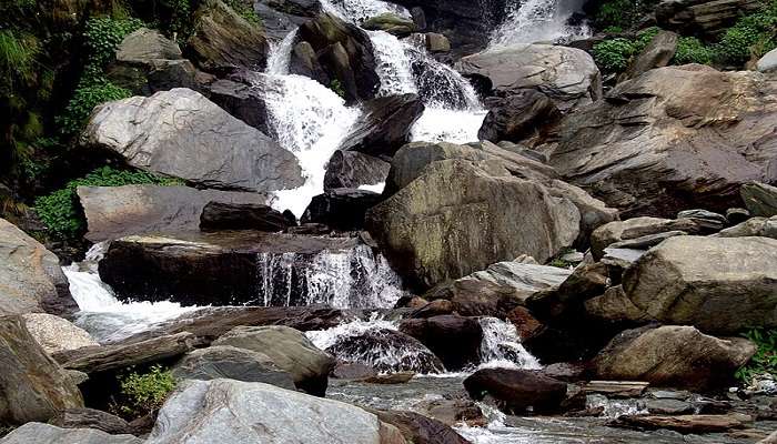 Serene view of Bhagsu Waterfall near Sujanpur Fort