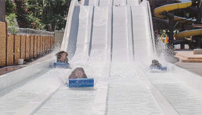 A vibrant and bustling Black Thunder Water Park featuring thrilling water slides, wave pools, and lively attractions.