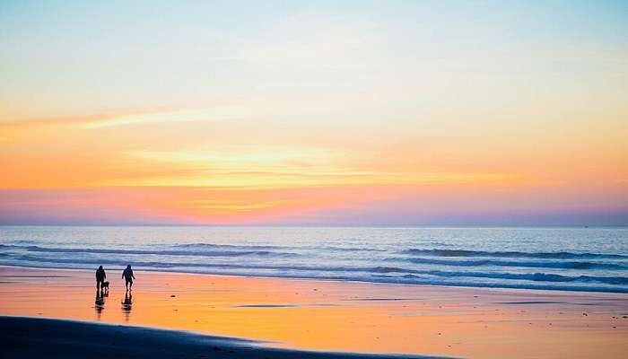 Family watching sunset at the beach at one of the famous Konaseema tourist places