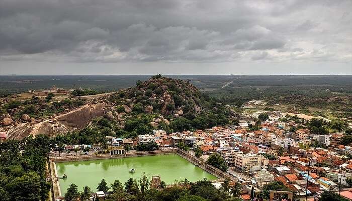 a drone shot of Sravanabelagola near Chaya Someshwara Temple