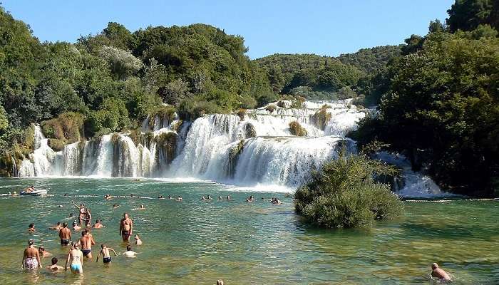 If the water levels are safe, you can dive into the base of the waterfall