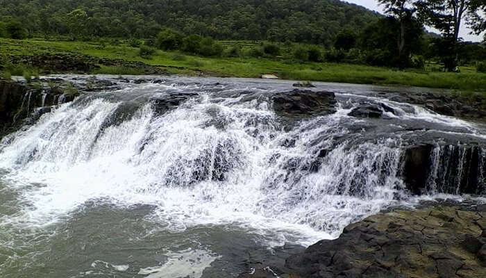 As you approach Kuntala Falls, you'll be greeted by the soothing sound of rushing water