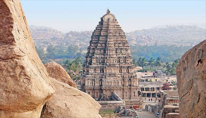 explore ancient temples in Hampi.